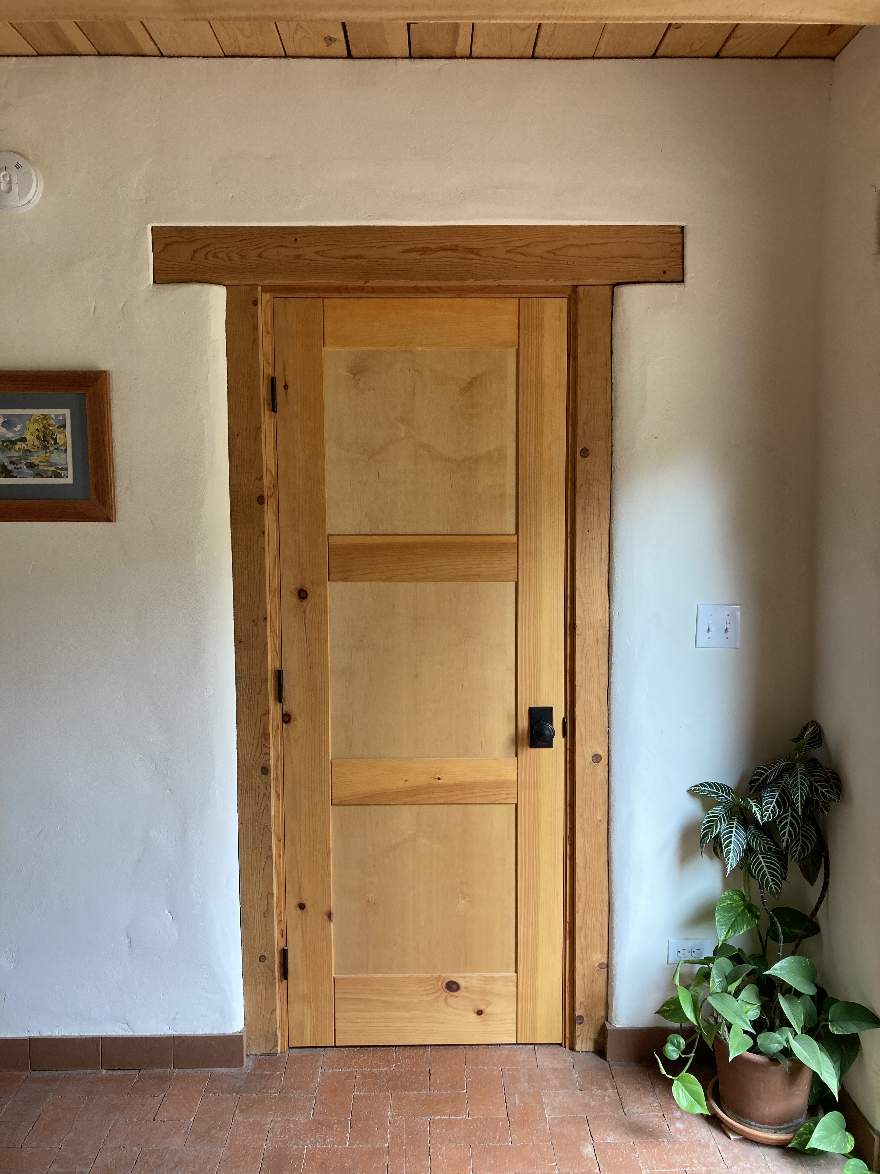 Interior custom doors in clean, New Mexican style